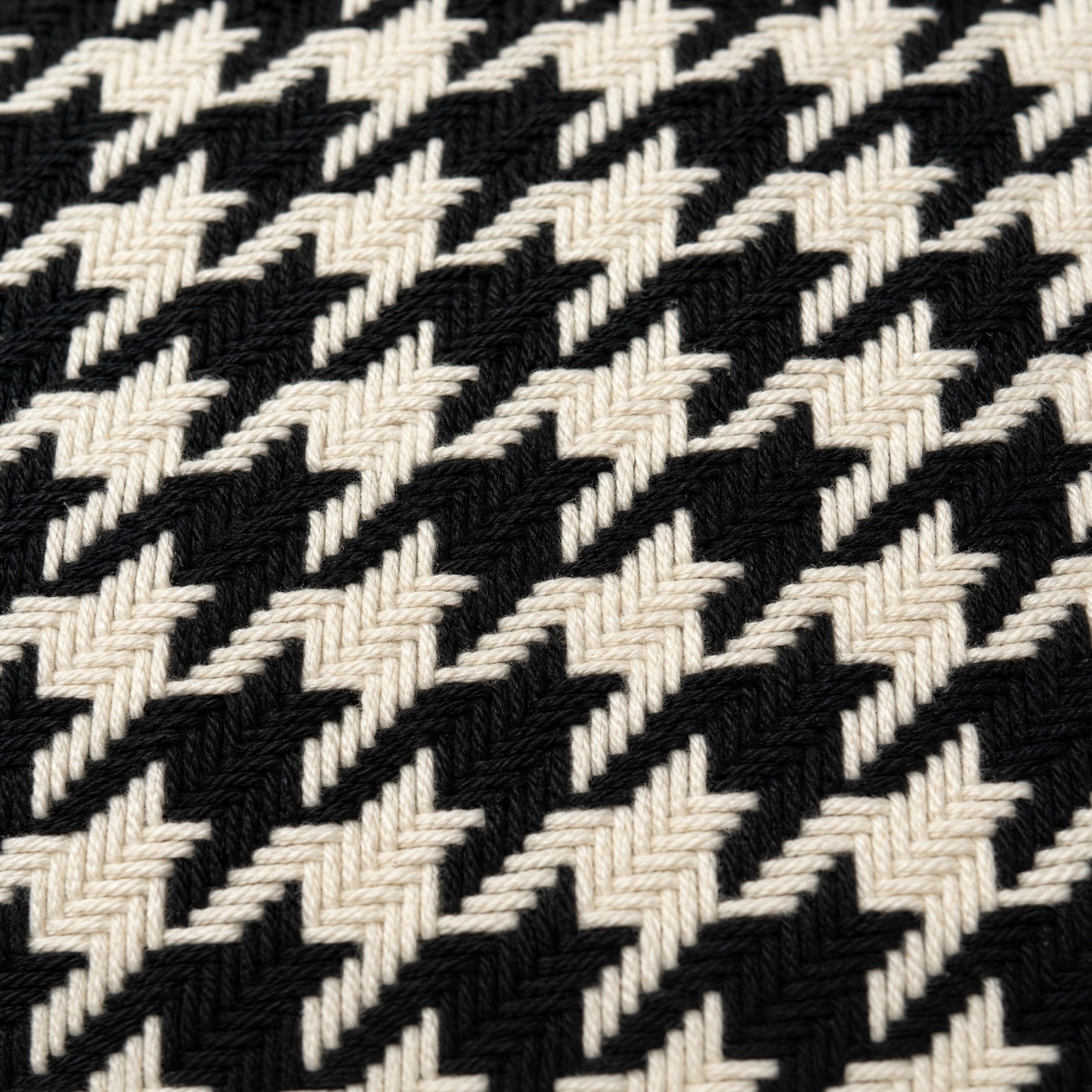 Close-up of black-and-white wool houndstooth weave
